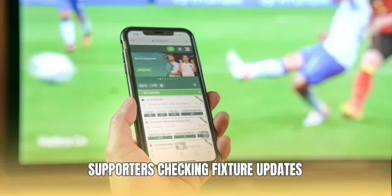 Supporters checking fixture updates