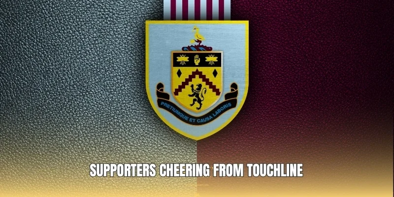 Supporters cheering from touchline