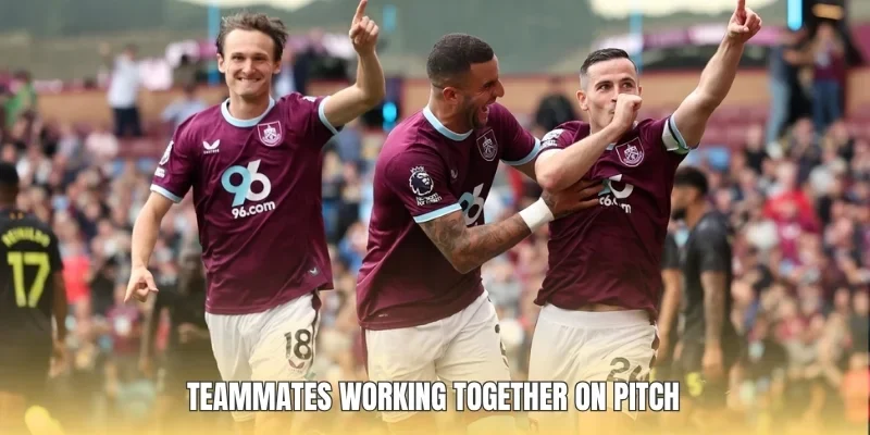 Teammates working together on pitch