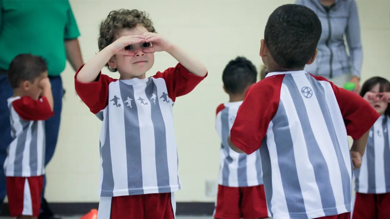 Children enjoying toddler football classes to build coordination and confidence