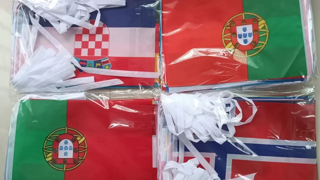 Football supporters proudly displaying team flags to show club loyalty