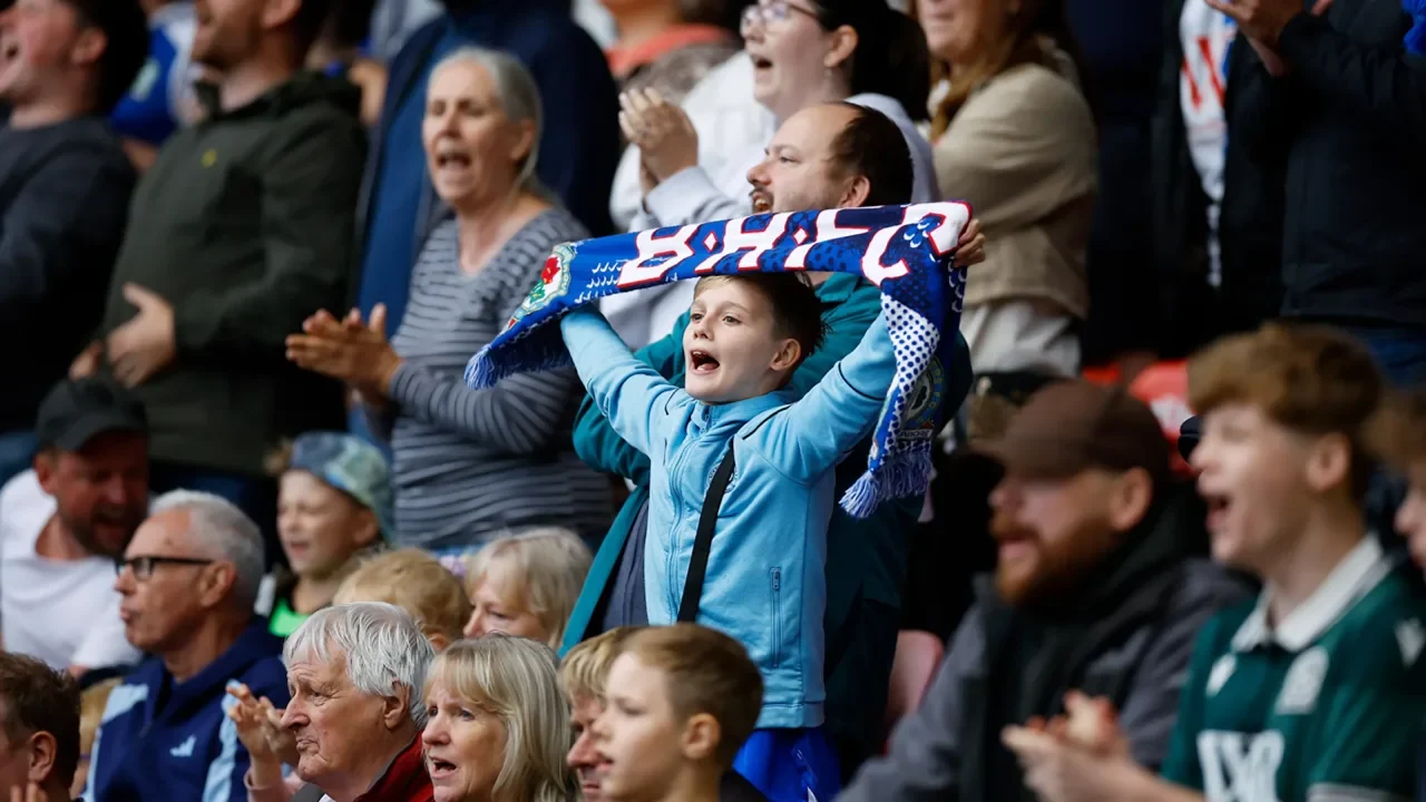 Supporters engaging in a fan forum UK community to discuss football news and matches